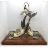 15" x 15" Desk bell and inkwells of white metal dolphins with horn bodies and plaque Tyne and Wear