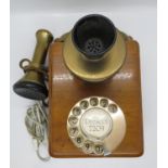 Wall mounted original early telephone with modern conversion