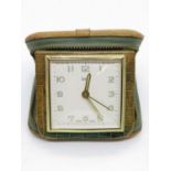 SWIZA coral travel clock in leather carry case in shape of travel case