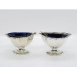 Set of English HM silver salts with blue liners and silver spoons