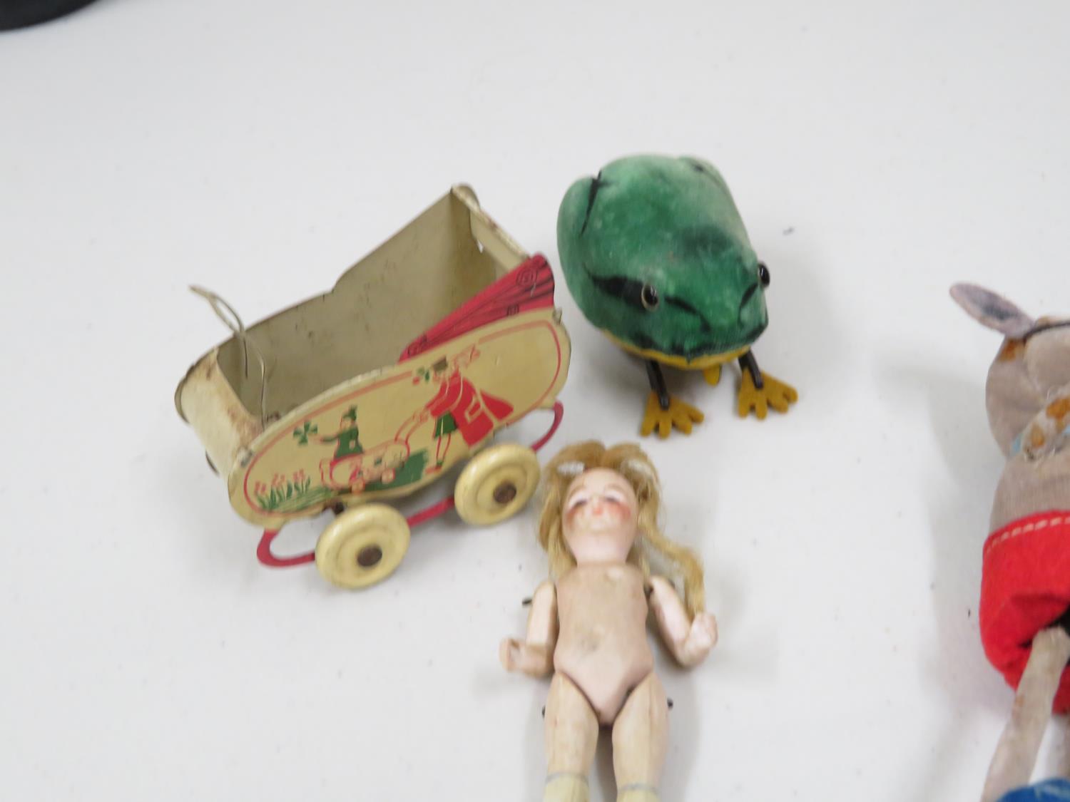 early tin plate pram with early vintage porcelain doll with articulated arms, legs and eyes. - Image 2 of 2