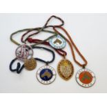 Collection of 1960's enamel racing lapel pendants