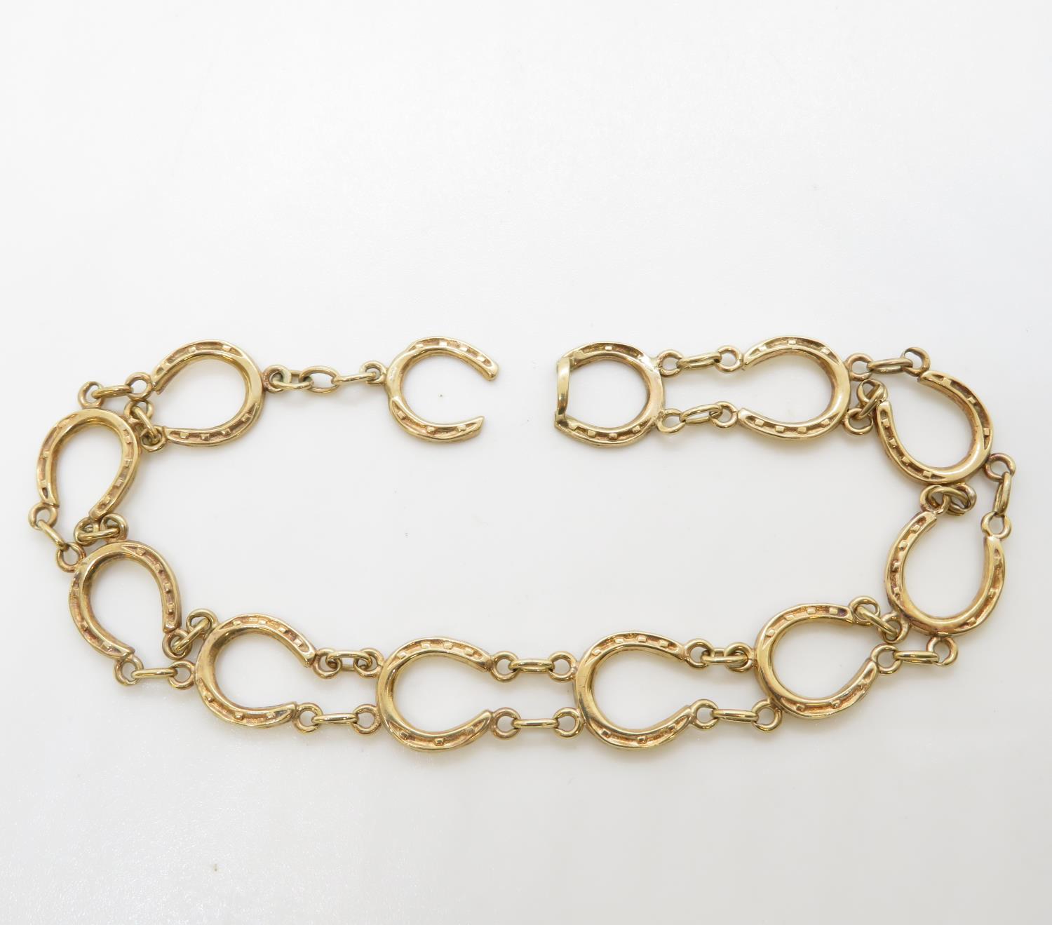 9ct gold HM bracelet of lucky horseshoes 9.5g