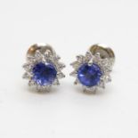 Platinum diamond and sapphire earrings - central half carat sapphire with halo of diamonds fully HM