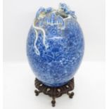 Early blue and white egg shaped vase signed to base with dragon figure crawling round top with bat -
