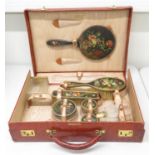 Superb ten piece travelling dressing set in silver gilt mounts with painted floral tops, mirror 2x