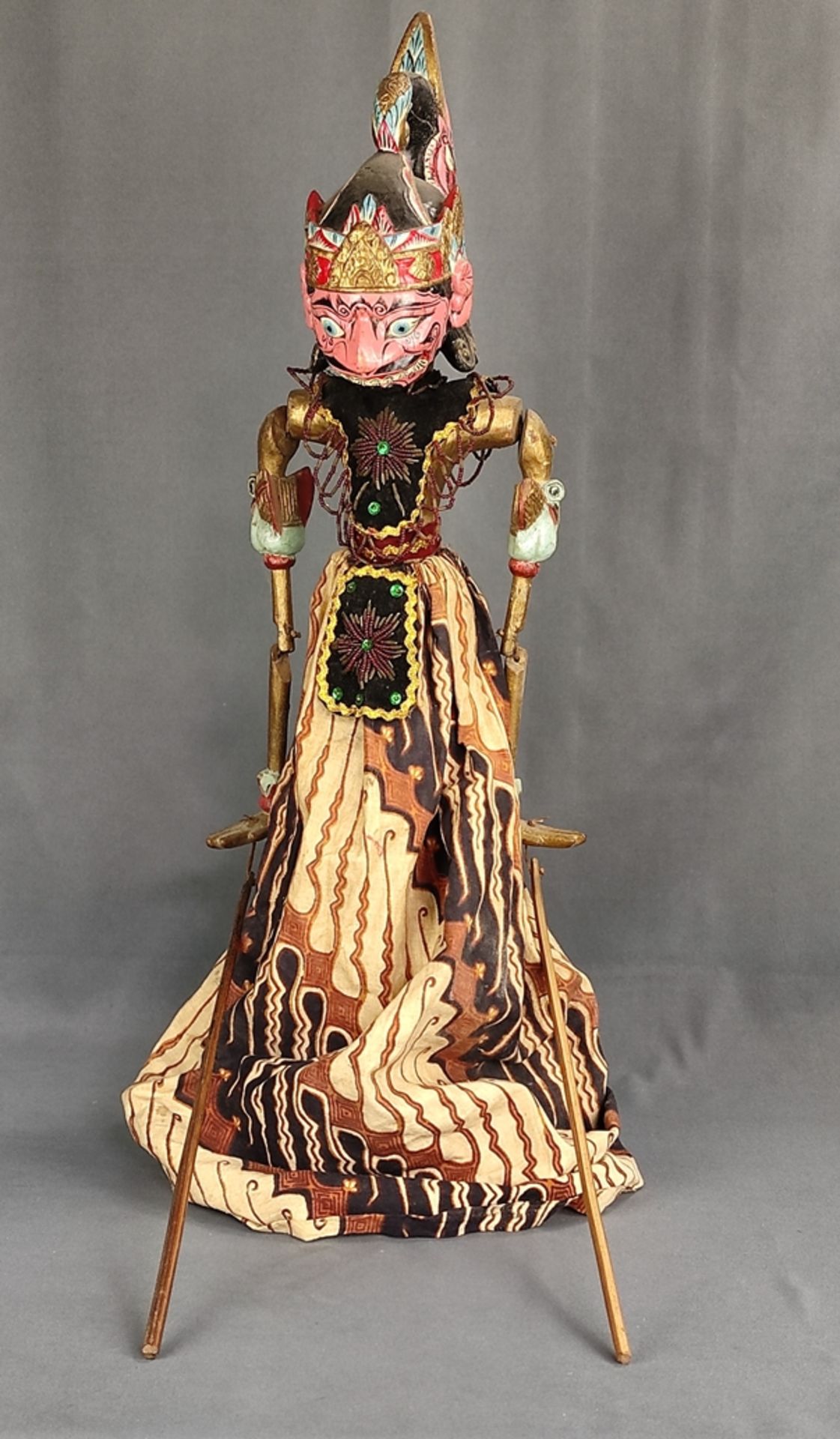 Wayang-Golek doll, Indonesian stick doll, head, torso and arms carved, clothes elaborately embroide