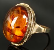 Ring with amber cabochon, natural inclusions, setting 333/8K yellow gold, 1st half 20th century, 4,