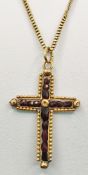 Cross as pendant on chain, inside on metal band set with irregular faceted garnets, chain and setti