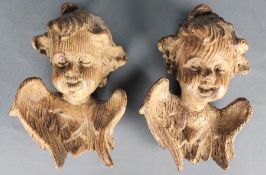 Zwei Engelsköpfe, lachende pausbäckige Gesichter, Holz, 19. Jahrhundert, 25x17x9cm, rückseitig mit 