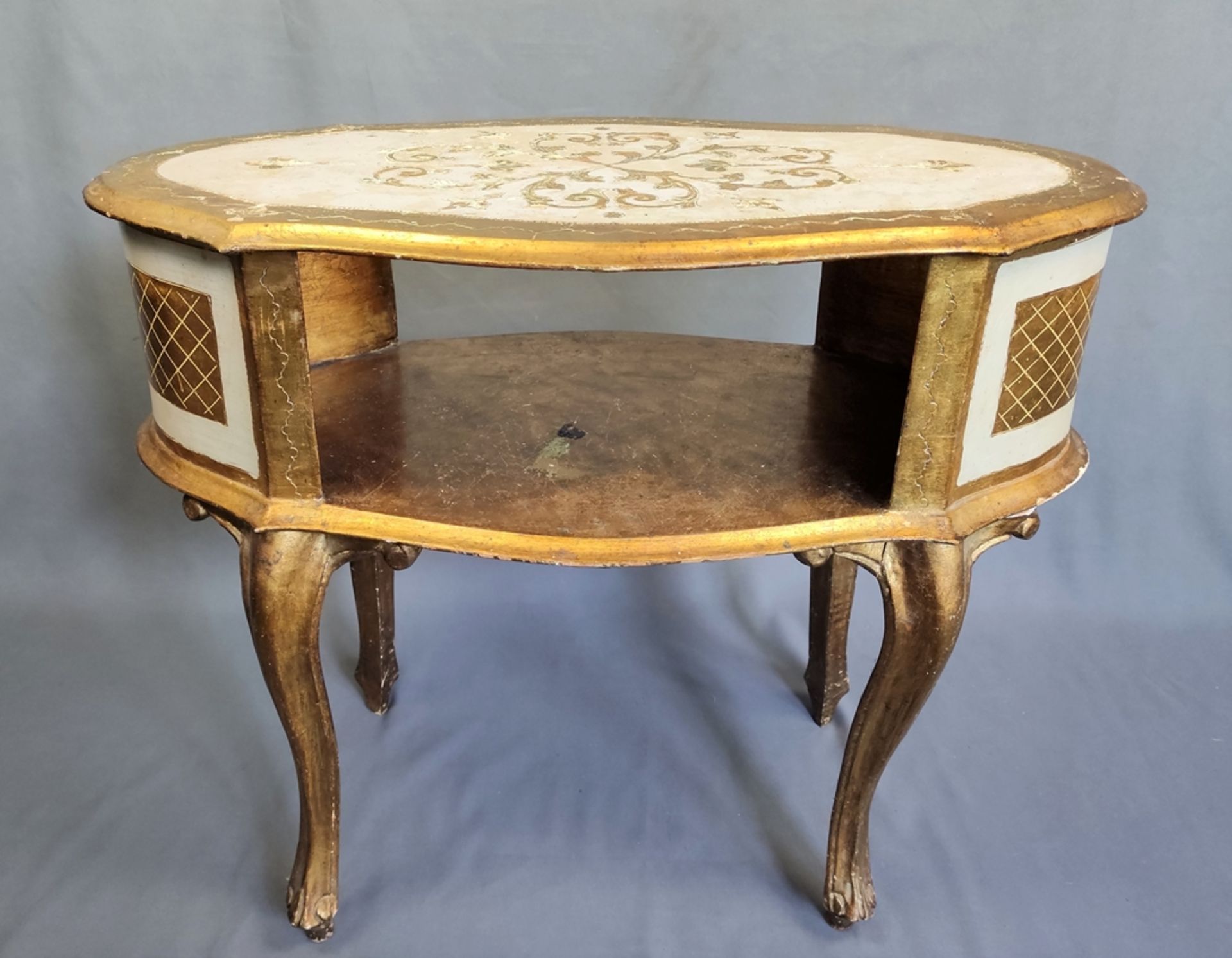 Small telephone table in baroque style on four curved legs, elongated, curved form with lower shelf