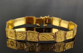 Armband, flexible Glieder mit verschiedenen christlichen Symbolen, 750/18K Gelbgold, 41,7g, Länge 18