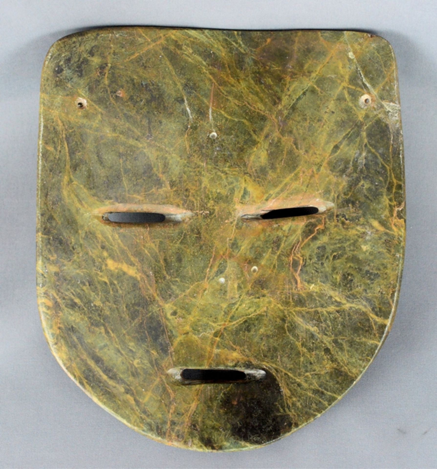 Stone mask, in the shape of a human head, flat nose, and a clearly raised cheek, slits for mouth an - Image 2 of 2
