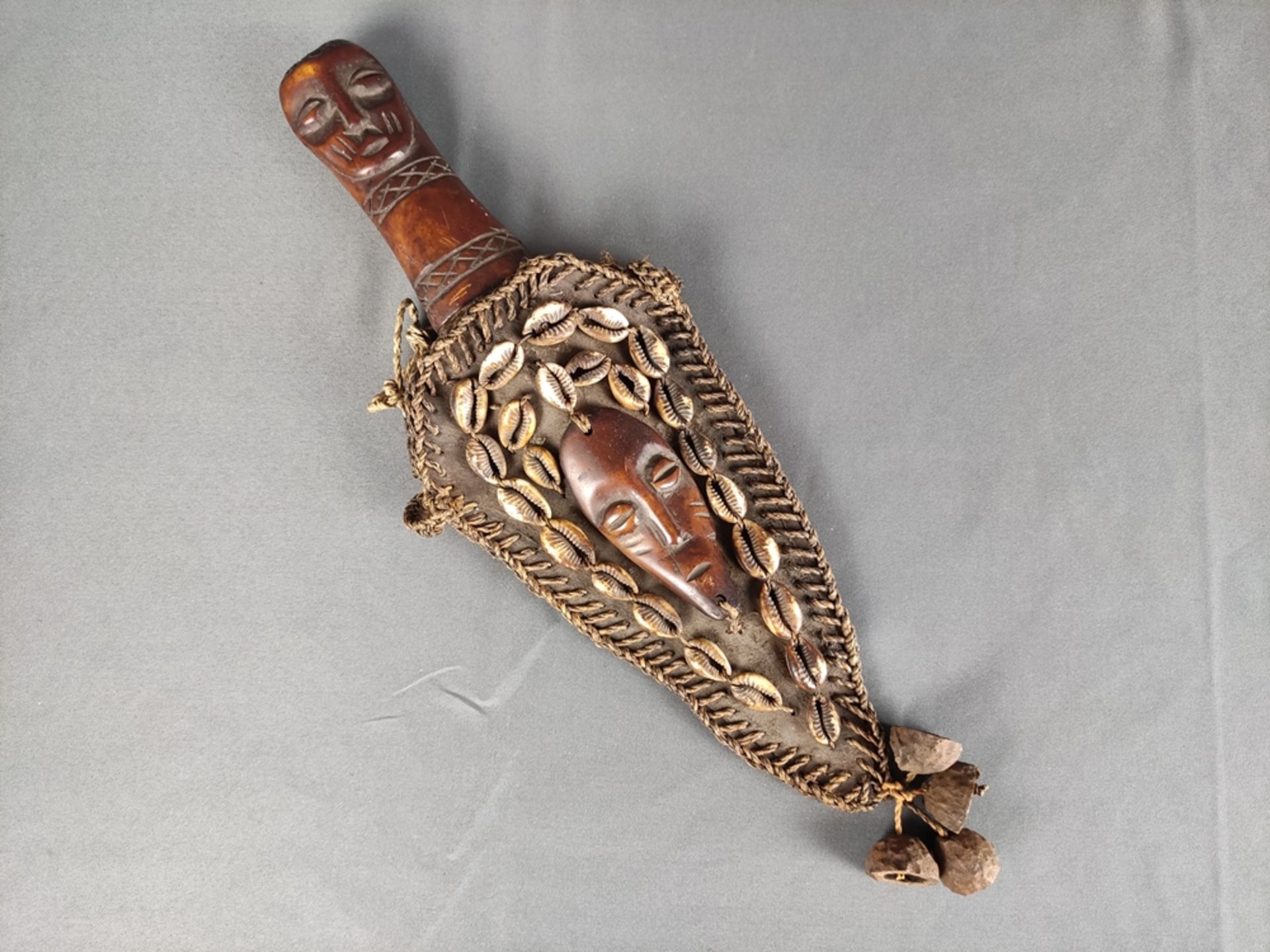 Copper dagger of the Yoruba, with wooden handle carved in the shape of a head, leather scabbard