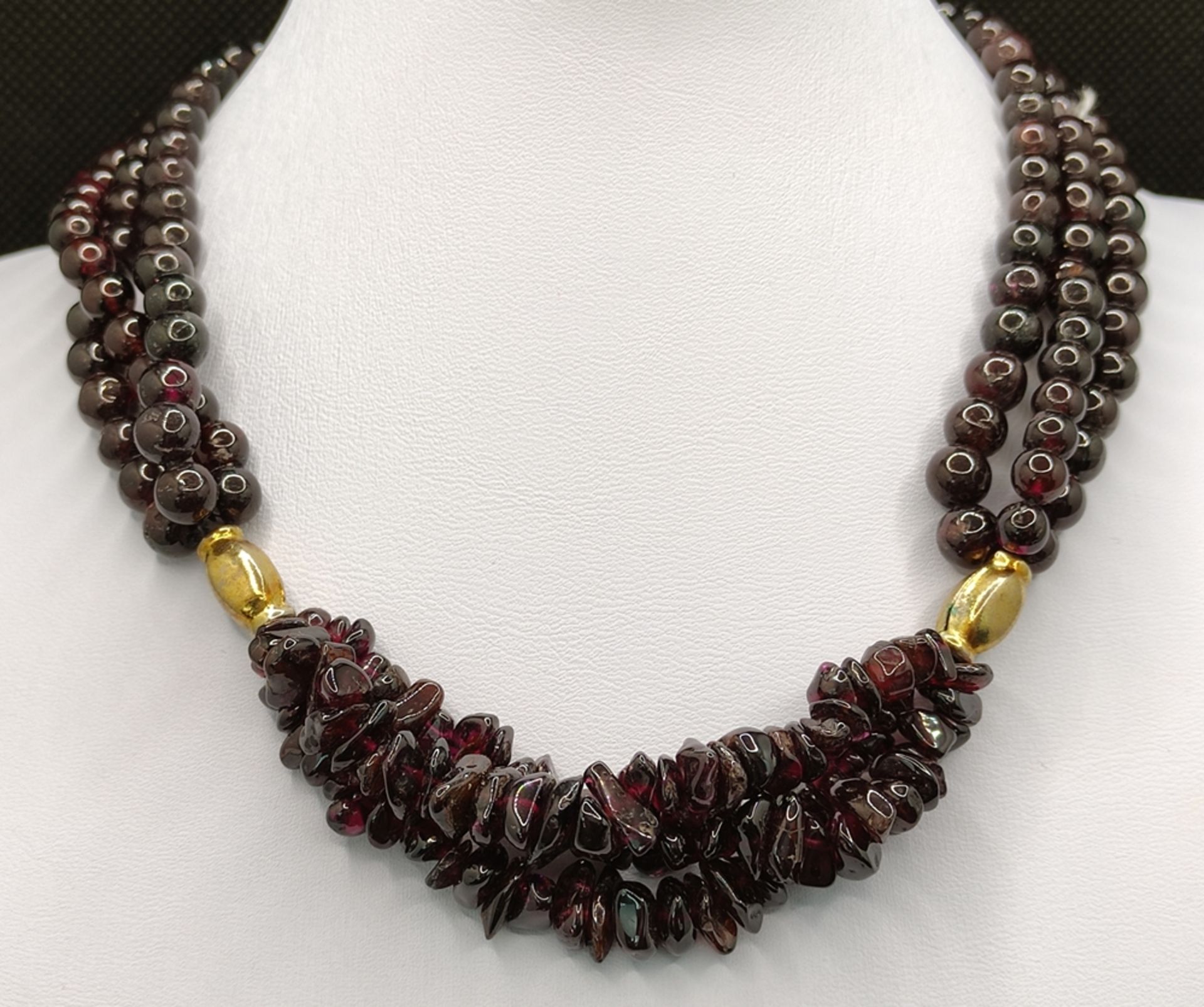 Garnet necklace, three strands, two gold plated elements in the middle, hook clasp, length 38cm - Image 2 of 2