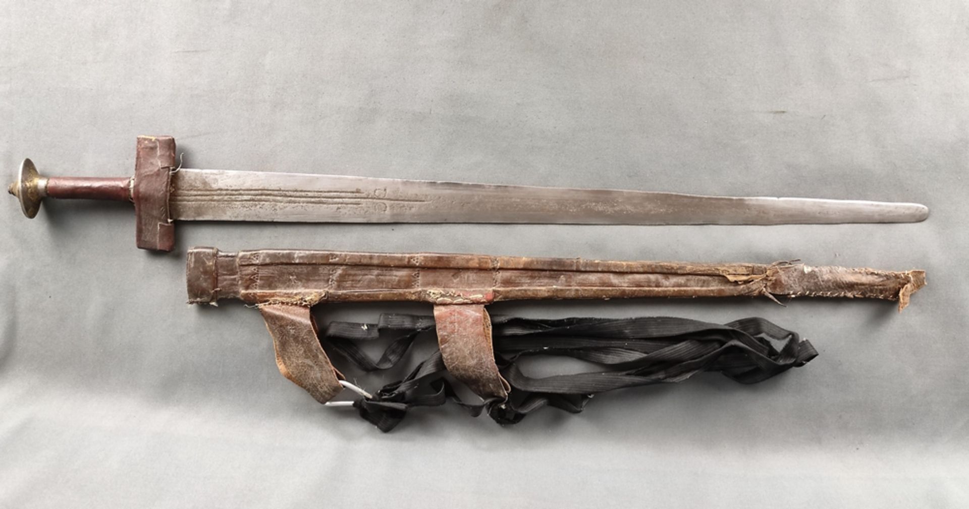 Sword of the Tuareg, double-edged blade with geometric decoration, 4 half-moon marks, quillons and