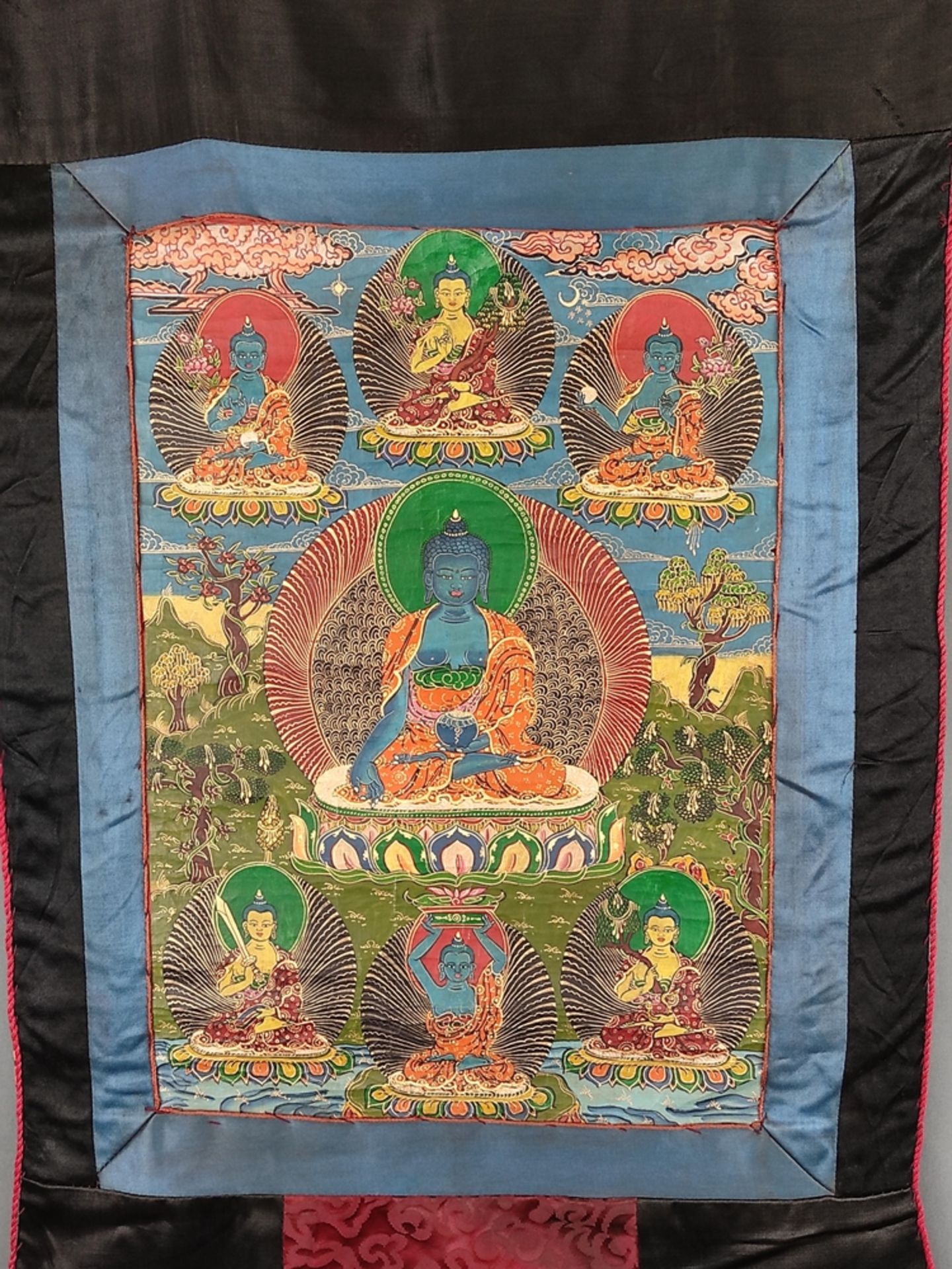 Thangka, with Bhai?ajyaguru (Medicine Buddha) in the centre, holding a bowl of healing elixir in his - Image 2 of 3