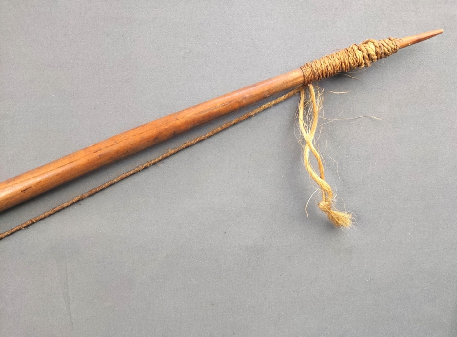 Bow made of rattan, with yarn as bowstring, probably Papua New Guinea, 19th century, l 140 cm