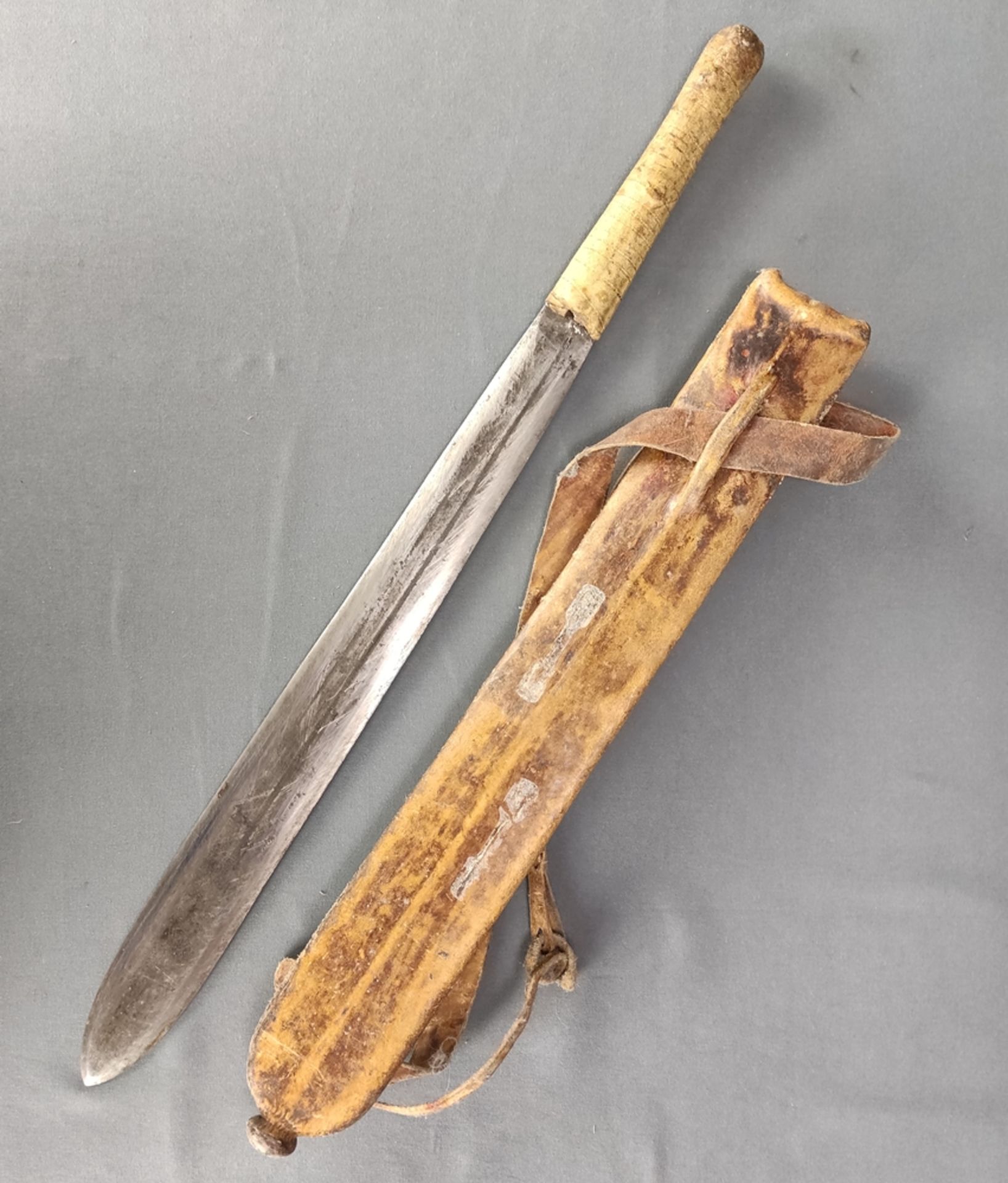 Antique bush knife, blade slightly flared to the bottom, tapered, double-edged, groove in the