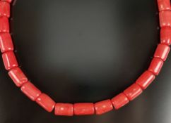 Big coral necklace, 32 cylindrical elements (each ca.26x16mm) on strand, gold plated lobster clasp,