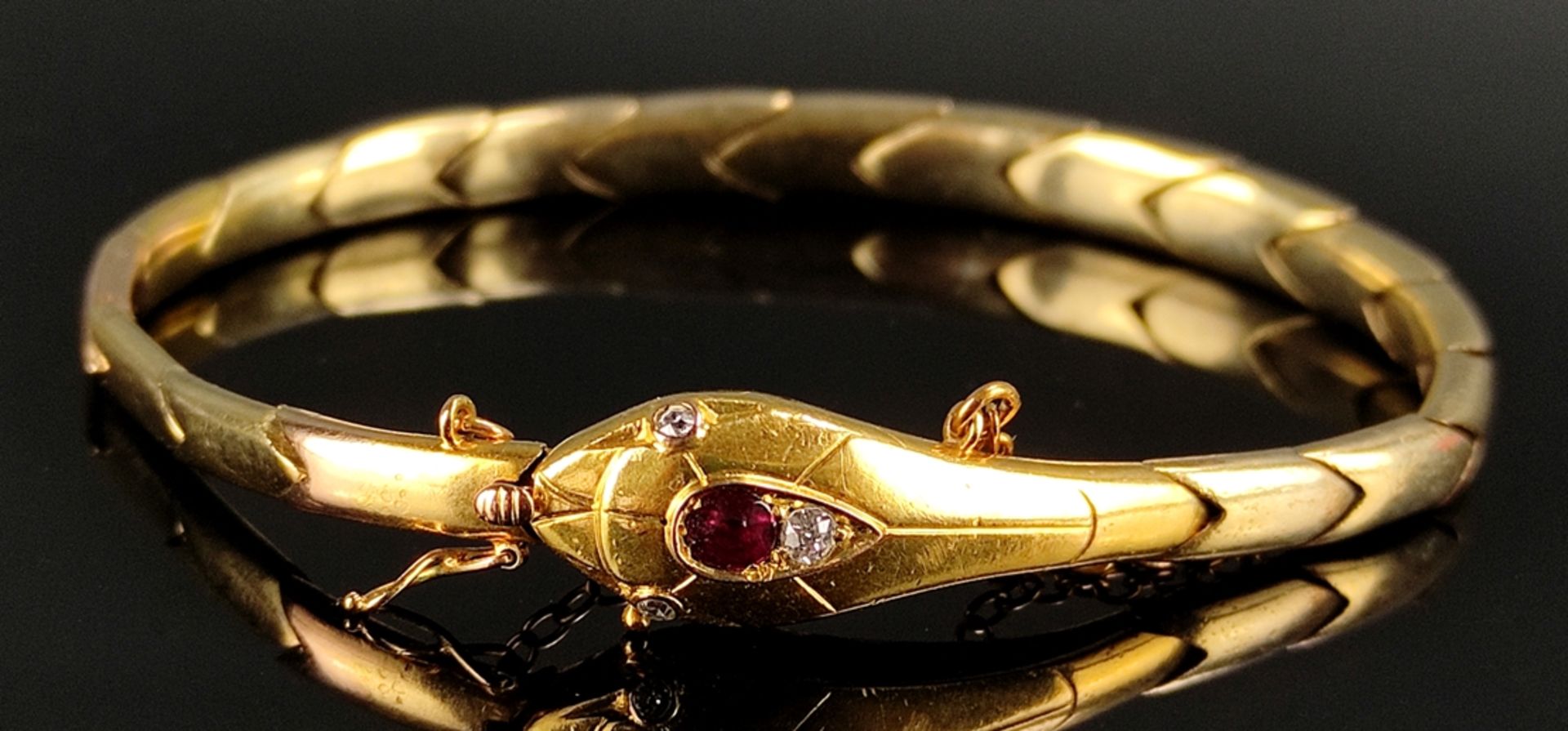 Antique snake bracelet, delicate elaborated head, in the center faceted ruby (diameter ca. 3,5mm),