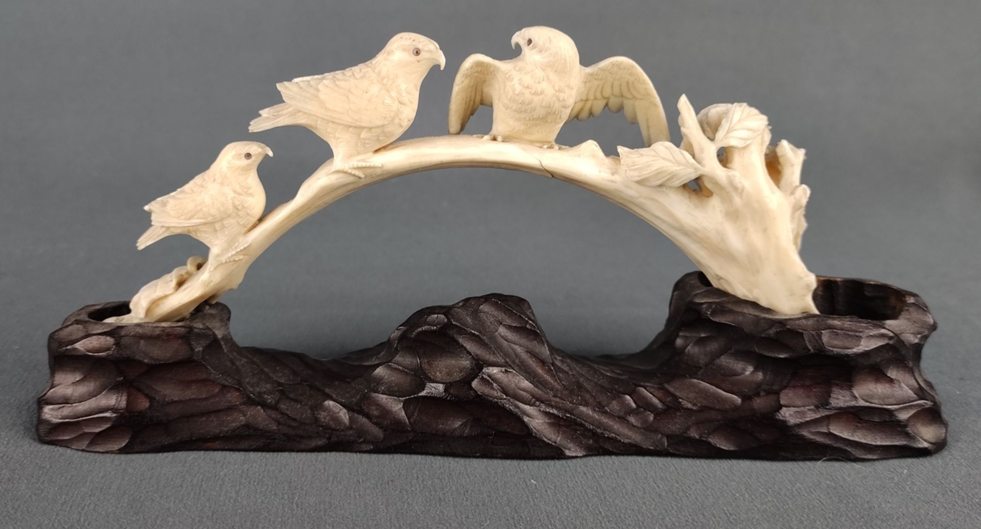 Bird figure, half bow, mounted on naturalistic wooden base, ivory, signed in rust red, Japan, early