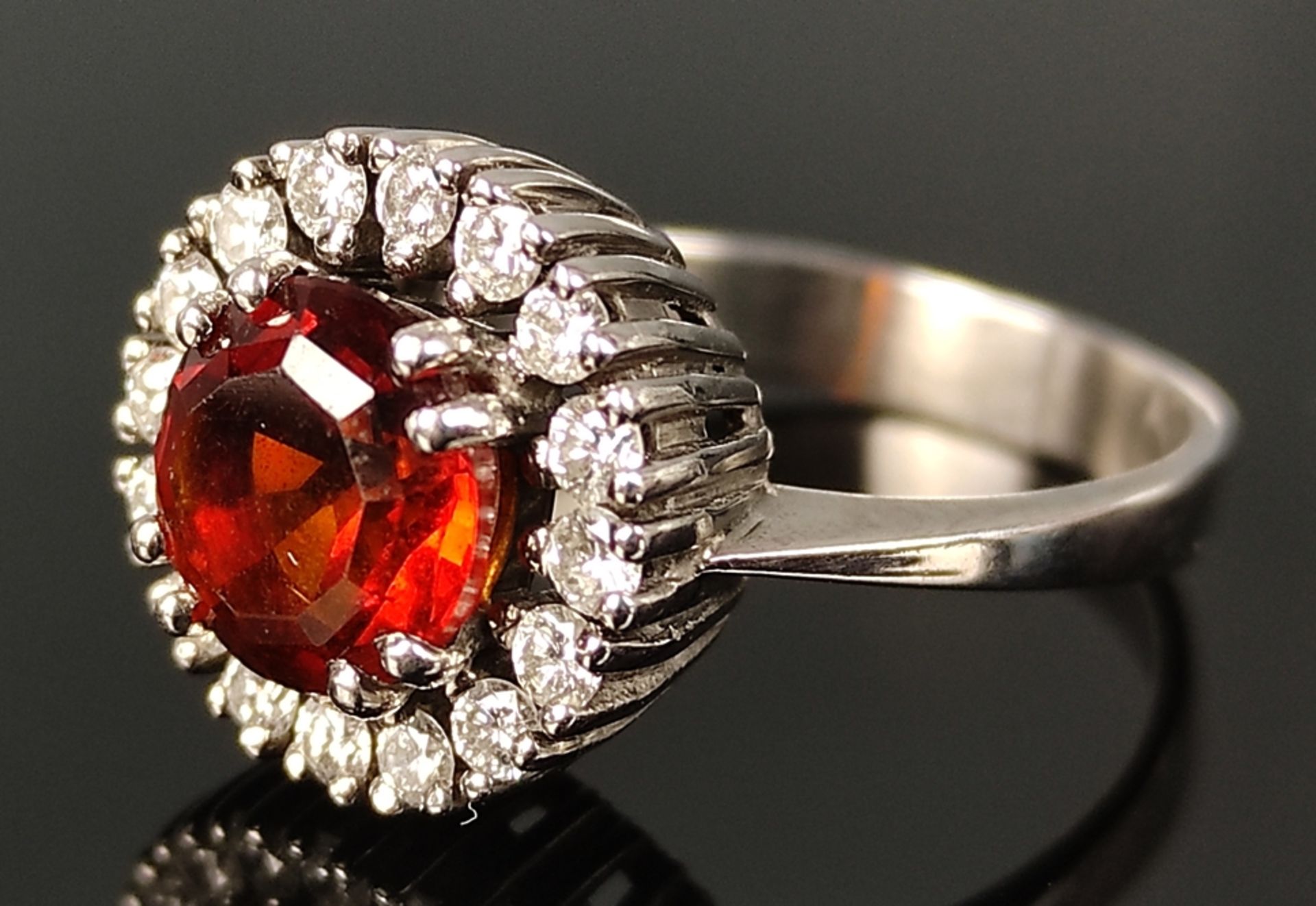 Fire opal ring, around it 16 diamonds around ca. 0,35ct, signed EP, 750/18K white gold, 5,6g, ring 