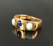 Opal-sapphire ring, sapphire cabochon in the center (ca.6x4mm), each next to it an oval cabochon, p