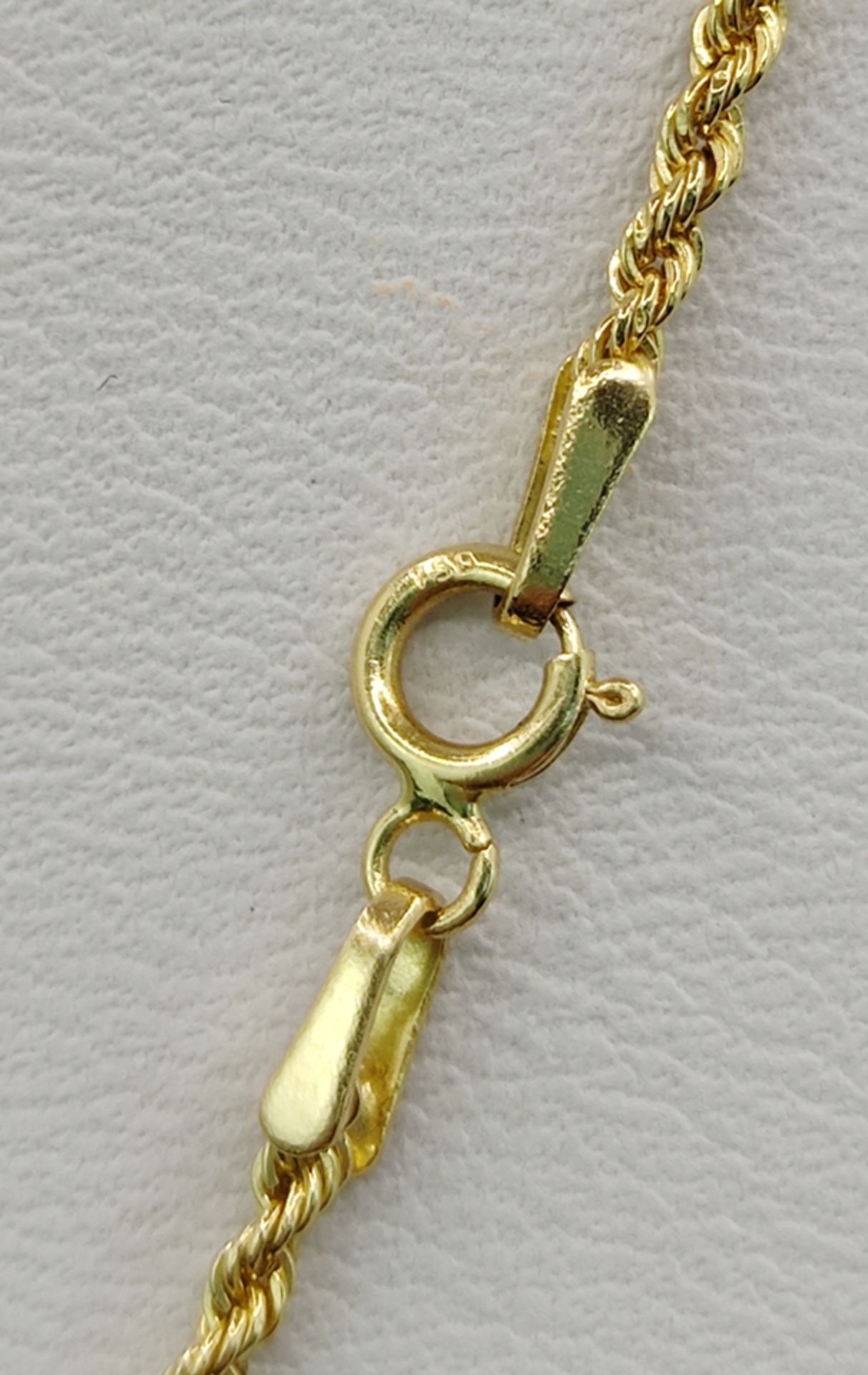 Pendant on cord chain, pendant with light blue gemstone, around it small diamonds, set in 585/14K y - Image 3 of 3