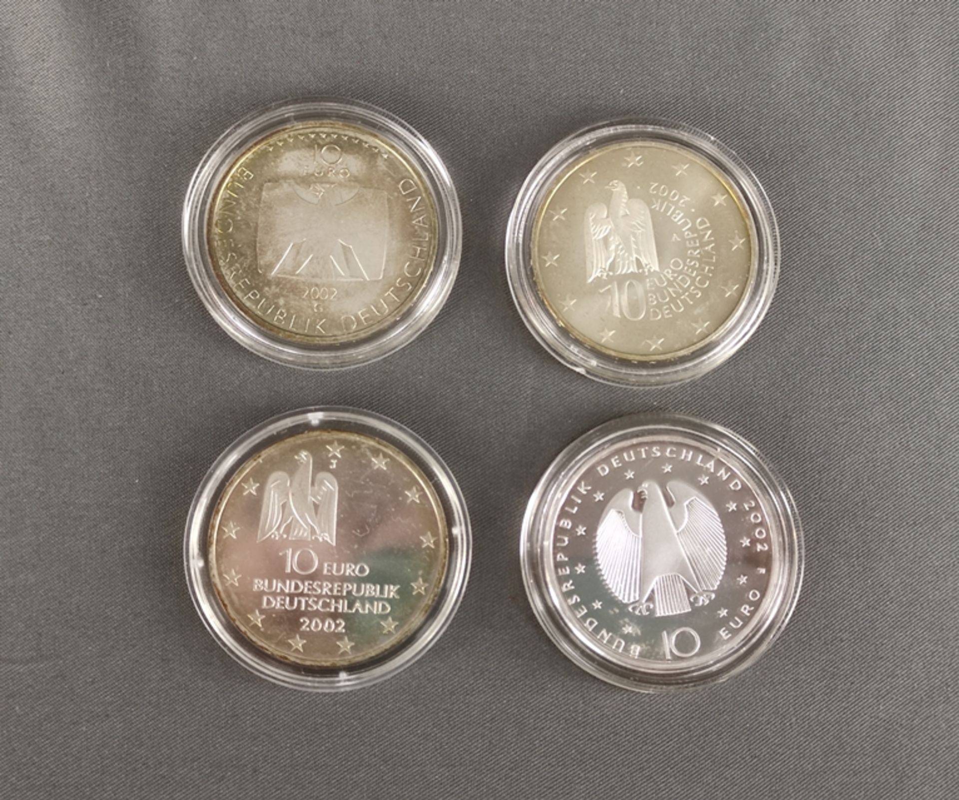 4 Silber-Münzen, Gedenkmünzen, je zu 10 Euro, Sterlingsilber, bestehend aus: 50 Jahre Deutsches Fer