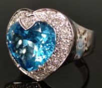 Large topaz ring, worked as a faceted heart, above it small diamond heart, around it more diamonds,
