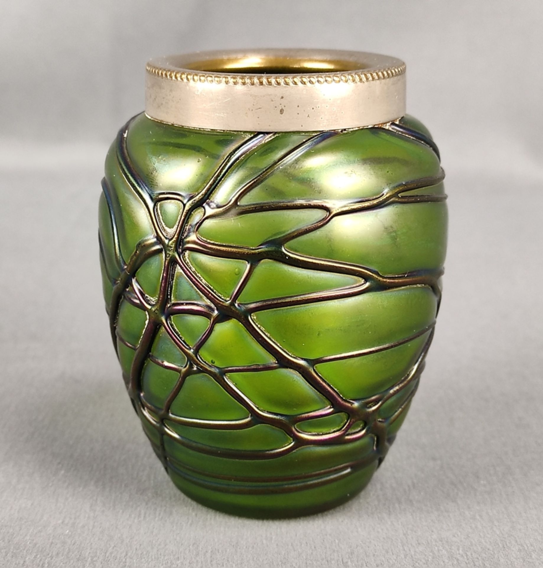 Small vase, slightly bulged, rim mounted, greenish glass, iridescent with fused green threads, irre