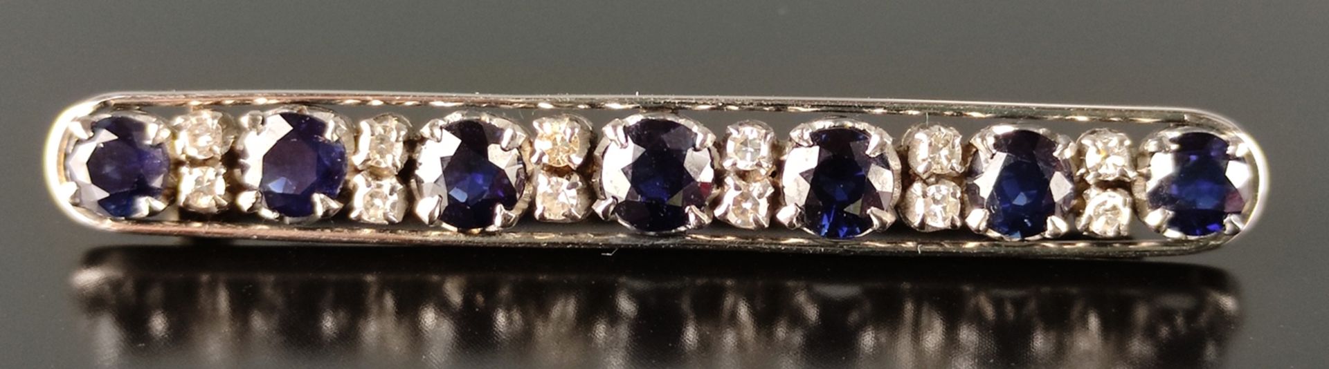 Sapphire diamond baton brooch set with 7 sapphires, together around 4ct, and 12 small diamonds, 585