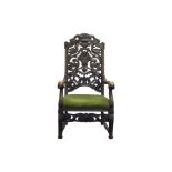 Armchair with carved backrest