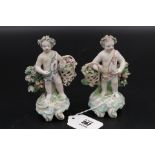 Pair 18th Centruty Putto Figures carrying baskets of flowers, slight nibbles on leaves.