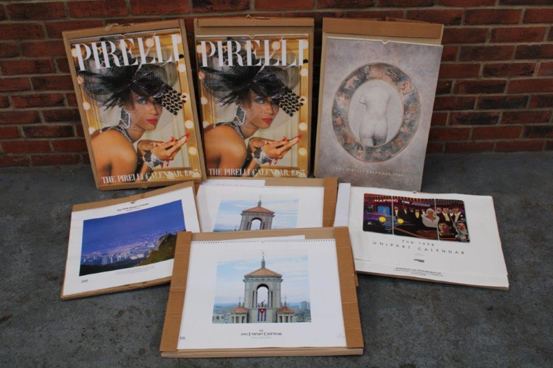 Four Unipart Calendars Together With Three Pirelli Calendars