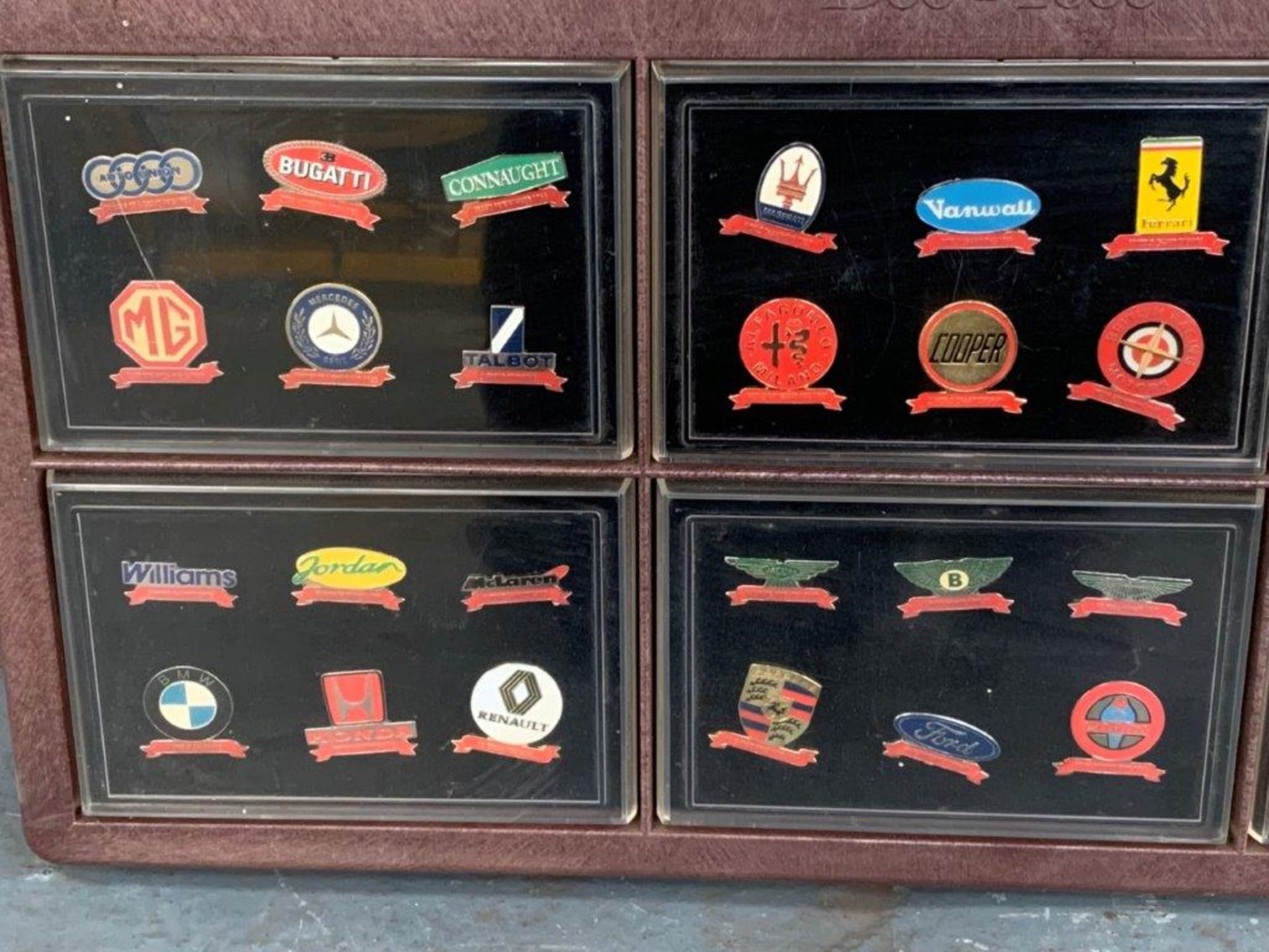 A Display Case Of 36 Car Badges - Image 2 of 3