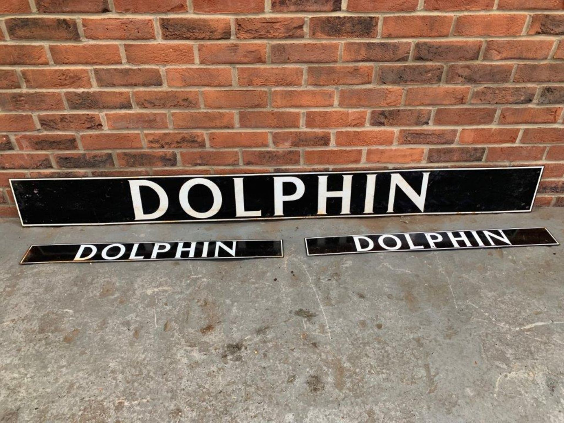 Three Dolphin Enamel Signs