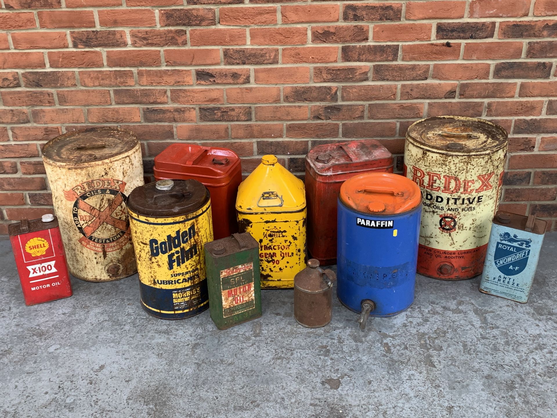 Eleven Vintage Oil Cans