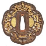 A MOKKO-SHAPE IRON NAMBAN TSUBA, chiselled and pierced with two dragons and a tama amidst scrolls,