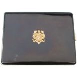 A STERLING SILVER BLACK ENAMELLED CARD CASE, the lid bearing the arms of Clan Mackenzie and the