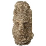 A SMALL STONE FRAGMENT HEAD OF BUDDHA, worn, 12cm high. From an established West Country