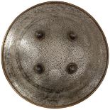 A LATE 18TH CENTURY CHISELLED STEEL INDIAN DHAL OR SHIELD, the 47cm diameter body profusely