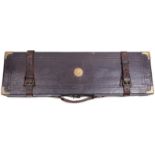 AN OAK FRAMED LEATHER COVERED GUN CASE, the relined interior for a gun with 28inch barrels, the