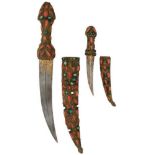 A MATCHED PAIR OF TURKISH OR OTTOMAN JAMBIYA, the first with 14.5cm curved fullered blade signed and