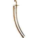 A 19TH CENTURY INDIAN KUTCH SHAMSHIR OR SWORD, 75cm sharply curved blade with watered decoration,