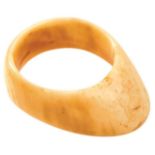 A 17TH CENTRUY OTTOMAN WALRUS IVORY ARCHER'S RING, with 4cm tapering oval shaped concave body.