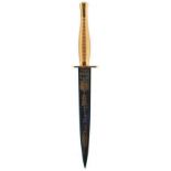 A FAIRBAIRN SYKES WILKINSON SWORD COMMEMORATIVE COMMANDO DAGGER, 17.75cm blued blade etched with the