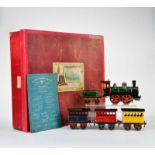 Bing, Eisenbahnpackung mit Uhrwerkslok, Tender + 3 Wagen