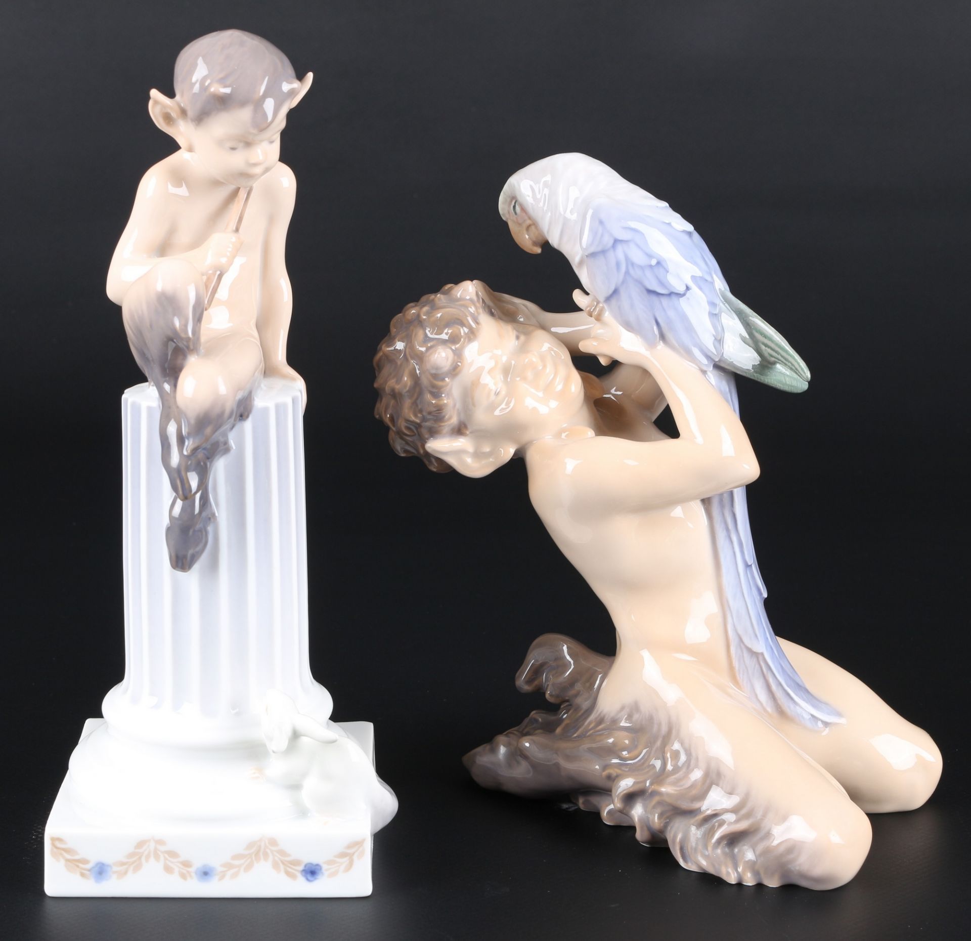 Royal Copenhagen 2 Figuren - Faun mit Papagei und Faun auf Säule, porcelain faun figures,